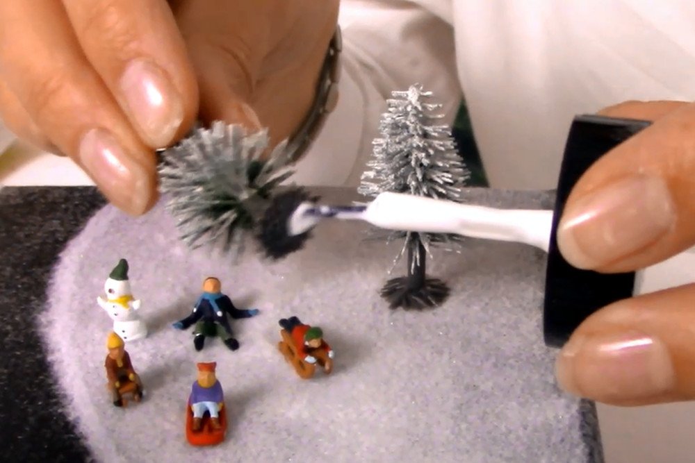 4) Decorate with figures and snow firs 